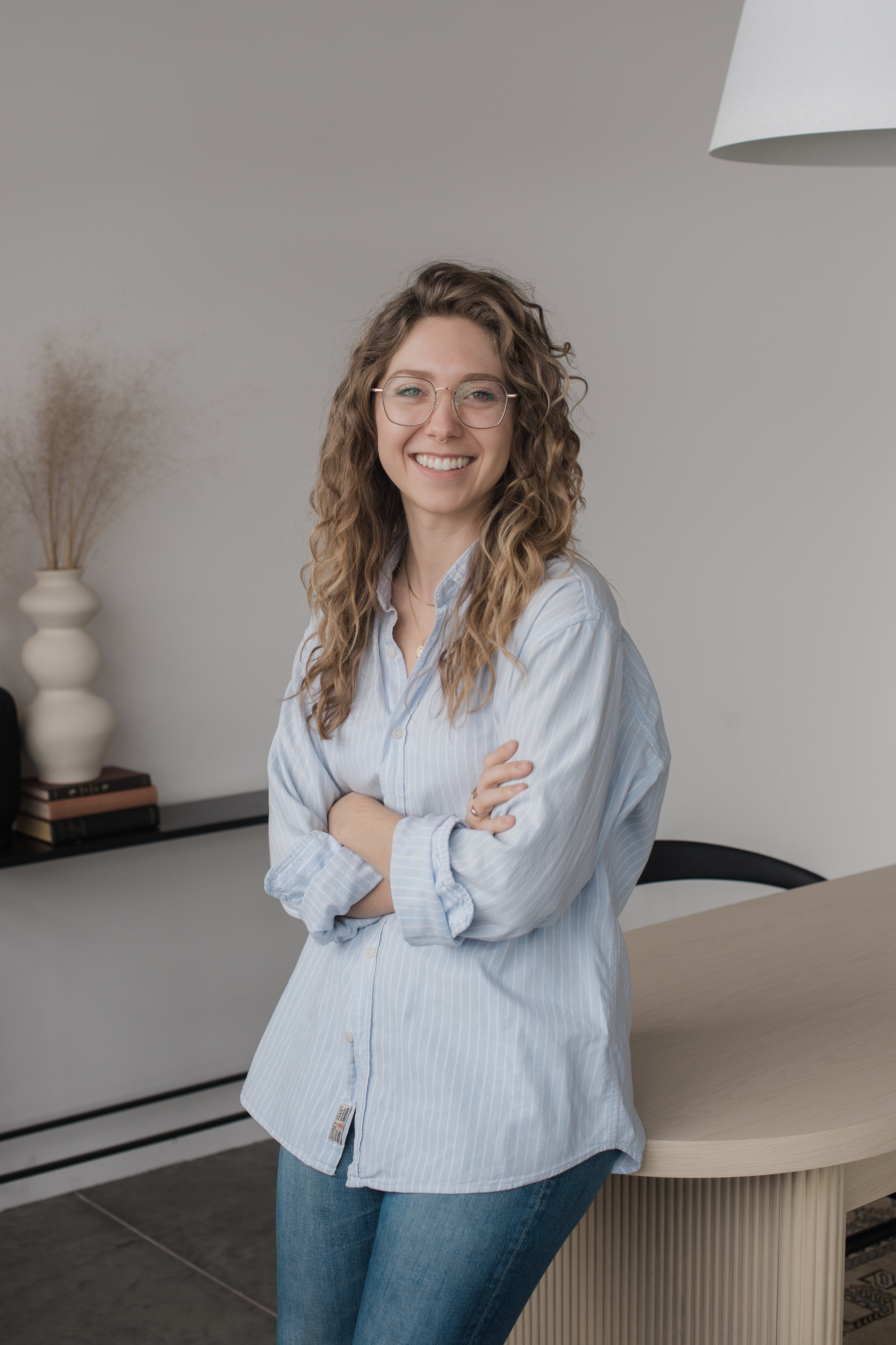 Courtney Redman smiling in a counseling office