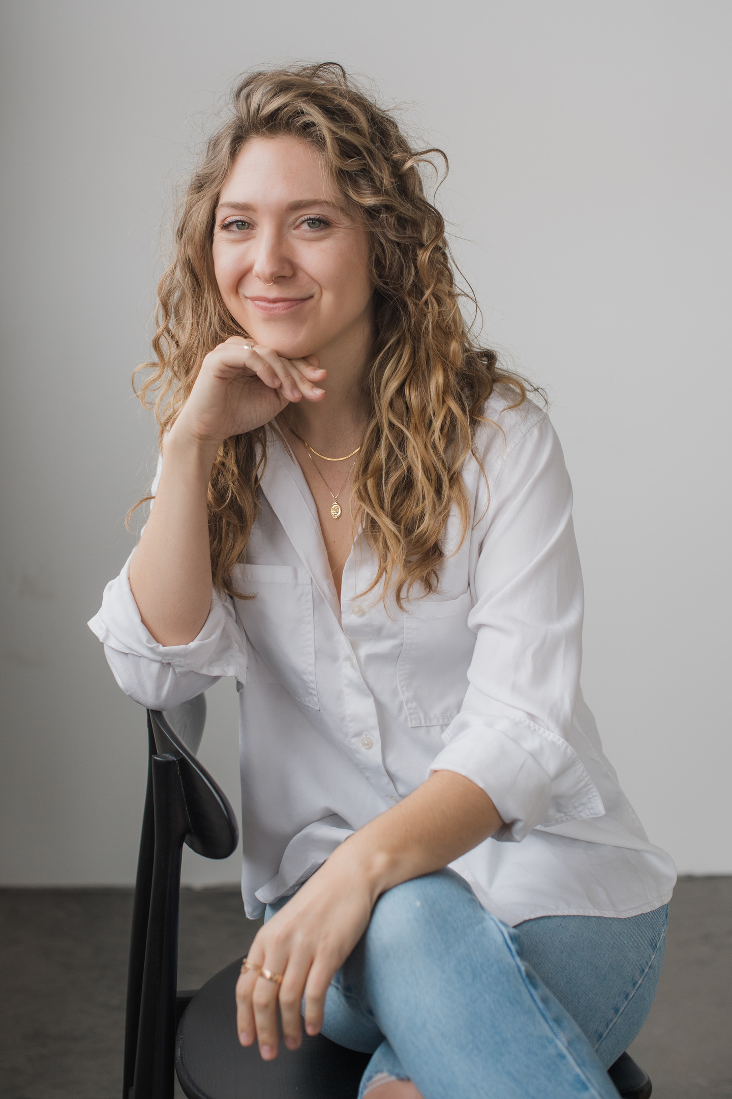 Courtney Redman smiling in a counseling office for individual therapy clients in Castle Rock, Colorado