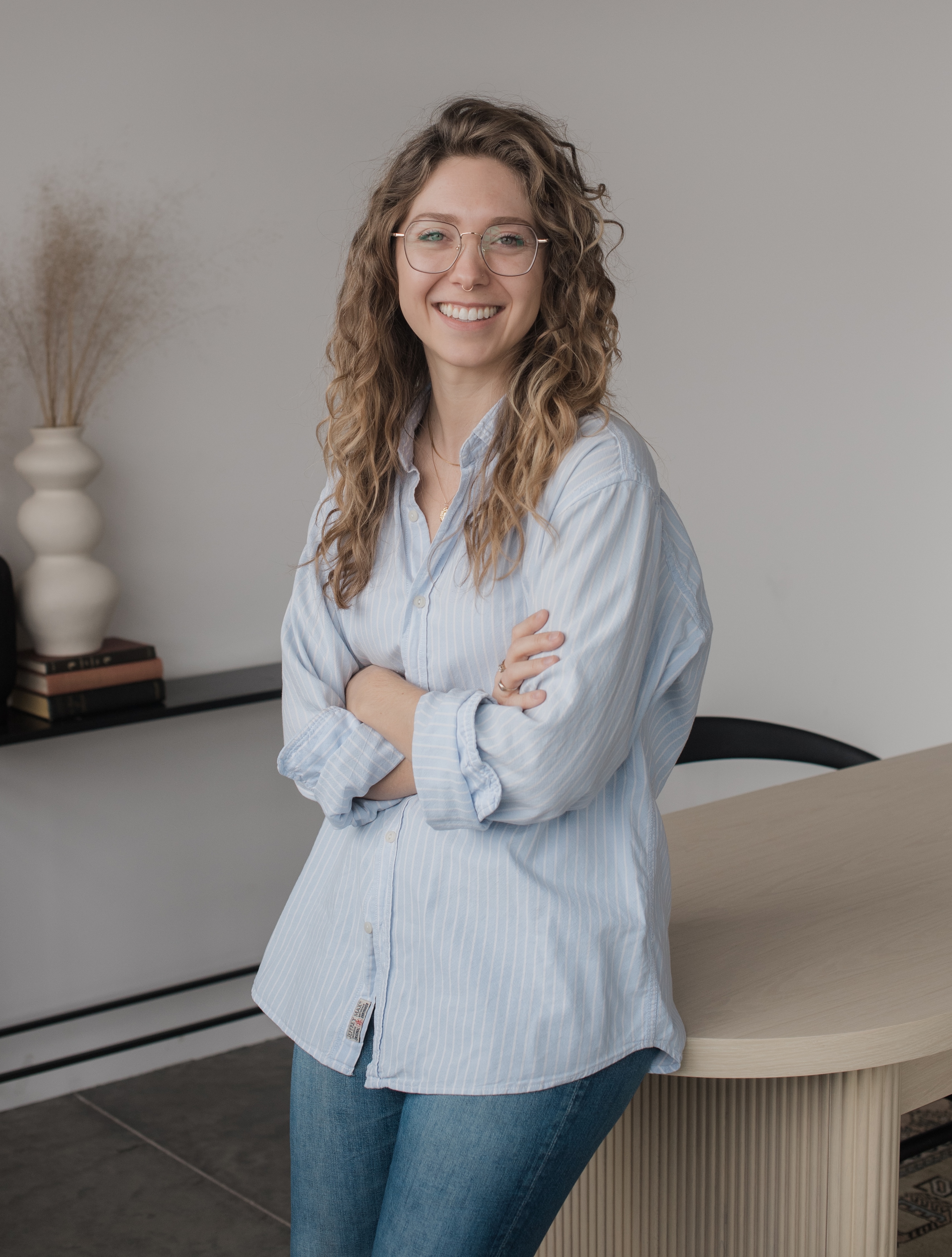 Courtney Redman standing in a therapy office
